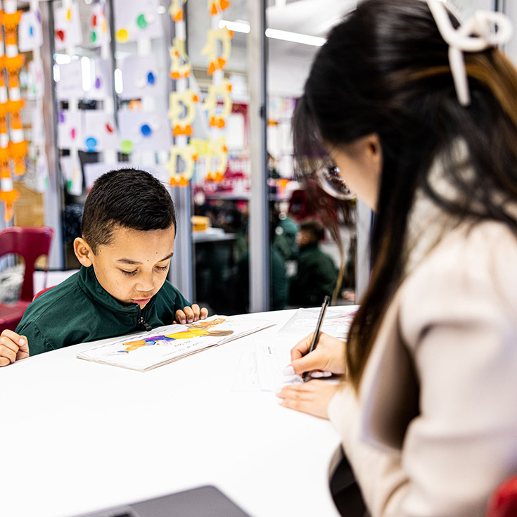 Teacher supporting student at Good Shepherd Catholic Primary Plumpton