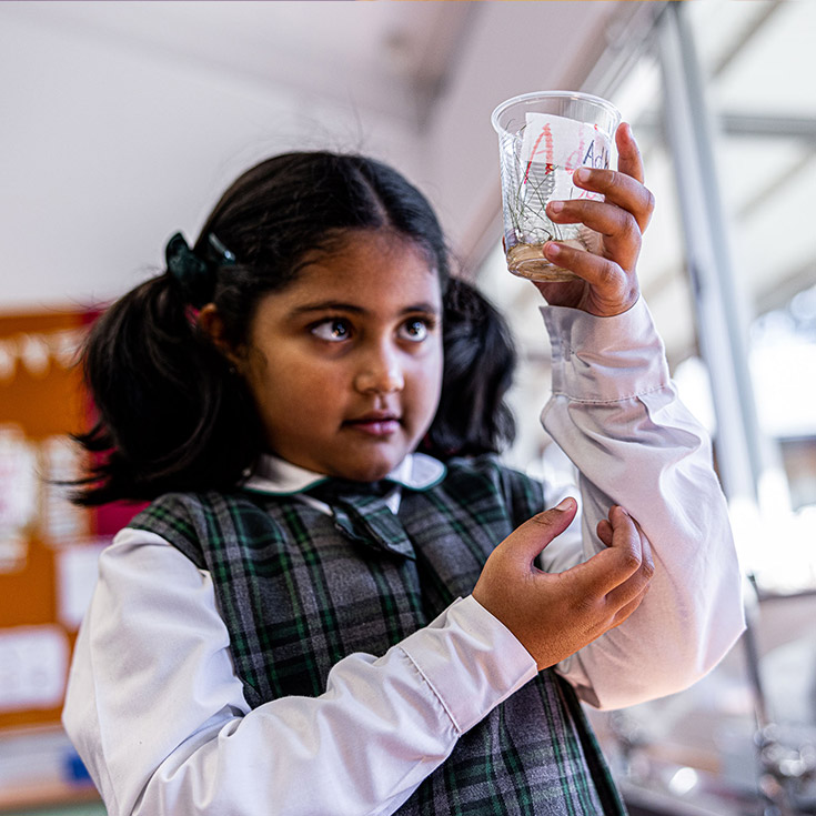 Girl doing science at Good Shepherd Catholic Primary Plumpton